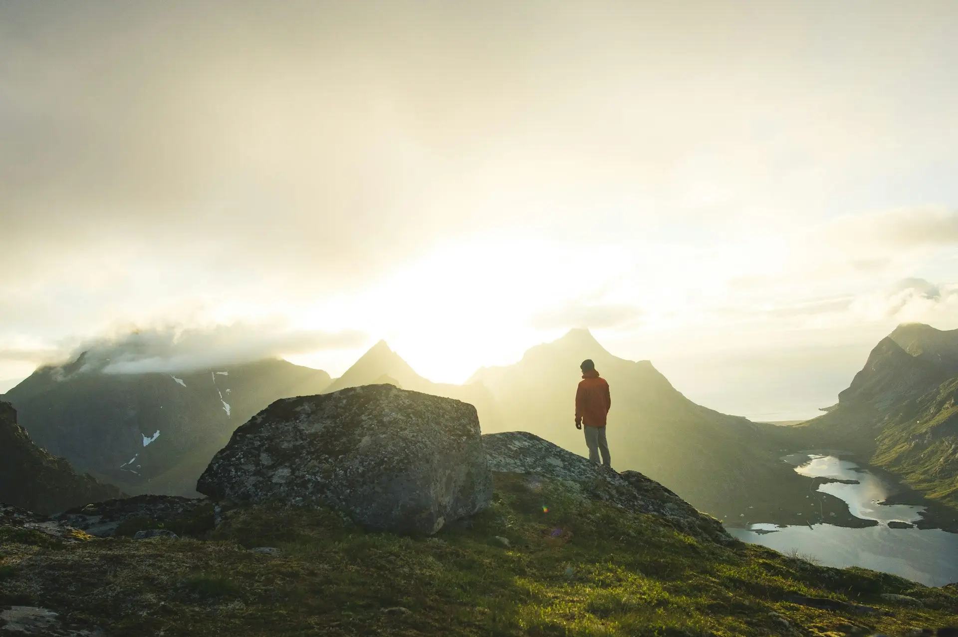 man standing on boulder