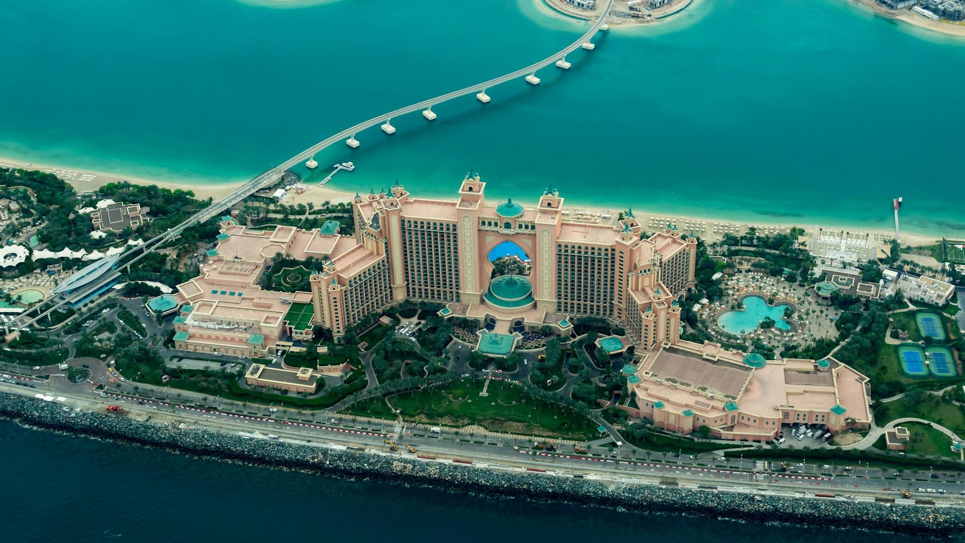 aerial photography of concrete buildings on the middle of the sea